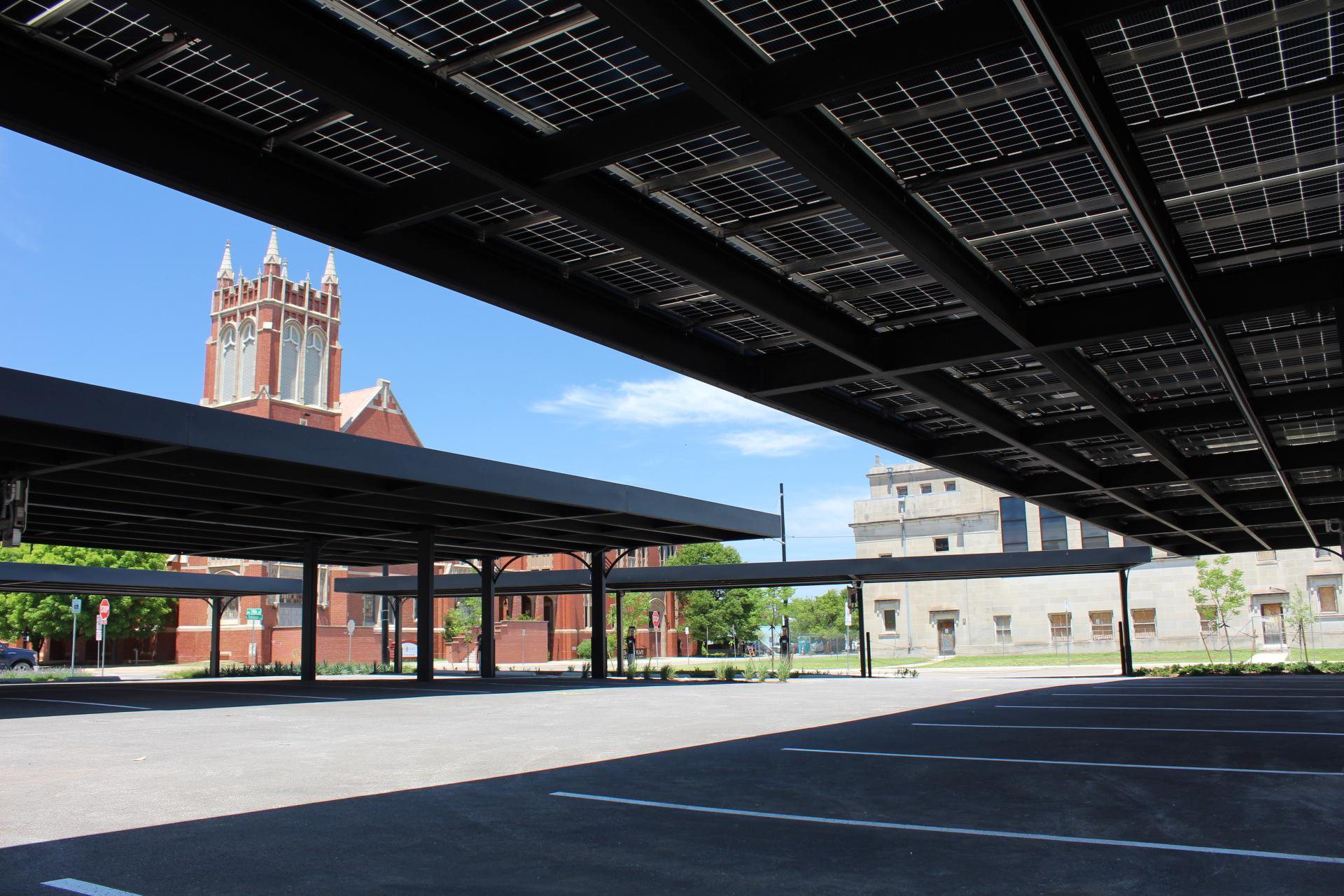 Steel carport canopy over an open parking lot in Oklahoma City