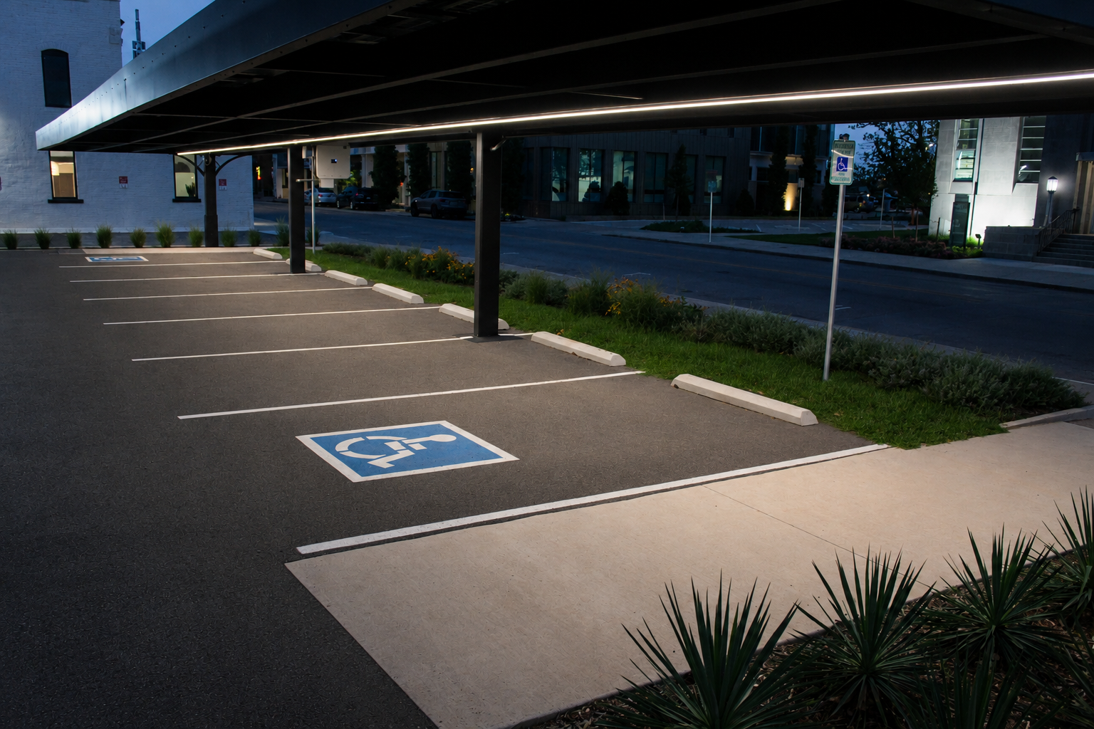 Perimeter LED edge lighting washing parked spaces at dusk